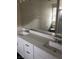Bathroom with double vanity, large mirror, and clean, white countertops and fixtures at 5414 Enchanted Rose St, Las Vegas, NV 89148