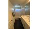 Bathroom with long vanity, single-basin sink, and bath with shower and curtain at 5414 Enchanted Rose St, Las Vegas, NV 89148