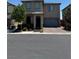 Charming two-story home with a welcoming front porch, attached garage, and well-manicured landscaping at 5414 Enchanted Rose St, Las Vegas, NV 89148