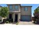 Two-story home with a two-car garage and well-maintained landscaping at 5414 Enchanted Rose St, Las Vegas, NV 89148