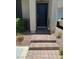 Inviting entryway with a black front door and brick-paved steps at 5414 Enchanted Rose St, Las Vegas, NV 89148