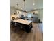 Kitchen with bar seating at the island and stainless appliances at 5414 Enchanted Rose St, Las Vegas, NV 89148