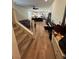Open-concept living room featuring wood floors and staircase at 5414 Enchanted Rose St, Las Vegas, NV 89148