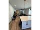 Open living space with kitchen island, living room, and dining area at 5414 Enchanted Rose St, Las Vegas, NV 89148