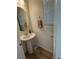 Powder room with pedestal sink, neutral paint, and a towel bar at 5414 Enchanted Rose St, Las Vegas, NV 89148