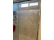 Shower with marble-look tile and glass doors at 5414 Enchanted Rose St, Las Vegas, NV 89148