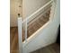Modern staircase with light carpeted steps and a white and silver railing at 5414 Enchanted Rose St, Las Vegas, NV 89148