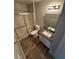 Neutral bathroom featuring a vanity with a gray countertop and a sliding glass door shower at 5710 E Tropicana Ave # 2225, Las Vegas, NV 89122
