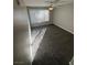 Bedroom featuring neutral-toned carpet, modern ceiling fan, and plenty of natural light at 5710 E Tropicana Ave # 2225, Las Vegas, NV 89122
