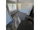 A dining area with two windows, a ceiling fan, gray carpet and modern kitchen components at 5710 E Tropicana Ave # 2225, Las Vegas, NV 89122