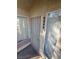 Close-up of unit entrance with secure door and bright natural light from nearby windows at 5710 E Tropicana Ave # 2225, Las Vegas, NV 89122