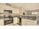 Well-equipped kitchen with stainless steel appliances, sleek countertop, and neutral tones at 5710 E Tropicana Ave # 2225, Las Vegas, NV 89122