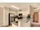 Modern kitchen with stainless steel appliances, ample storage, and stylish countertops at 5710 E Tropicana Ave # 2225, Las Vegas, NV 89122