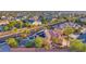 An aerial view of a desert community showing a home with solar panels and backyard pool at 5805 Cabo San Lucas Ave, Las Vegas, NV 89131