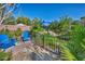 Secluded backyard featuring mature landscaping, a shaded seating area and tranquil koi pond at 5805 Cabo San Lucas Ave, Las Vegas, NV 89131