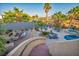 Aerial view of a luxury backyard with a pool, hot tub, fireplace, and outdoor seating, perfect for entertaining guests at 5805 Cabo San Lucas Ave, Las Vegas, NV 89131