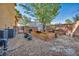 View of the backyard with gravel, garden beds, and block wall fencing at 5805 Cabo San Lucas Ave, Las Vegas, NV 89131