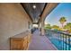 View of the balcony featuring a decorative dresser with an outdoor living space overlooking the landscaped backyard with a pool at 5805 Cabo San Lucas Ave, Las Vegas, NV 89131