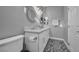 Bathroom featuring dual sinks, patterned tile floor, and white cabinets at 5805 Cabo San Lucas Ave, Las Vegas, NV 89131