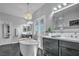 Bathroom featuring a freestanding tub, dual vanities, and bright lighting at 5805 Cabo San Lucas Ave, Las Vegas, NV 89131