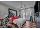 This primary bedroom features wood floors, light gray walls, and French doors to the outside at 5805 Cabo San Lucas Ave, Las Vegas, NV 89131