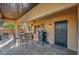 Spacious covered patio with outdoor kitchen, dining area, and access to backyard at 5805 Cabo San Lucas Ave, Las Vegas, NV 89131