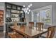 Dining room with stylish lighting, shuttered windows, and custom shelving at 5805 Cabo San Lucas Ave, Las Vegas, NV 89131