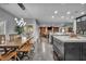 Open-concept view of dining room, living room, and kitchen featuring stylish decor and modern finishes at 5805 Cabo San Lucas Ave, Las Vegas, NV 89131
