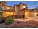 Attractive two-story home featuring an attached two-car garage and a meticulously maintained front yard at 5805 Cabo San Lucas Ave, Las Vegas, NV 89131