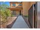 Charming home featuring a manicured lawn and inviting walkway that leads to the front door at 5805 Cabo San Lucas Ave, Las Vegas, NV 89131