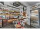 Custom garage bar, with wooden countertops, chrome detailing, auto part decor, and shelving at 5805 Cabo San Lucas Ave, Las Vegas, NV 89131