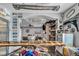 Garage bar showcasing a custom countertop, auto part decor and views to the living room at 5805 Cabo San Lucas Ave, Las Vegas, NV 89131