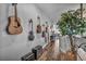 Hallway featuring guitars hanging on the wall and a decorative plant at 5805 Cabo San Lucas Ave, Las Vegas, NV 89131
