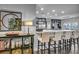Bright kitchen with stainless steel appliances, white marble counters and black cabinets at 5805 Cabo San Lucas Ave, Las Vegas, NV 89131
