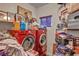 Organized laundry room with front-loading red machines and ample storage at 5805 Cabo San Lucas Ave, Las Vegas, NV 89131