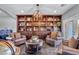 Cozy living area with custom built-ins, pool access, and comfortable seating arrangements at 5805 Cabo San Lucas Ave, Las Vegas, NV 89131
