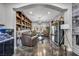 Open living room showcases custom built-ins, modern lighting, a fireplace, and easy access to the pool area at 5805 Cabo San Lucas Ave, Las Vegas, NV 89131