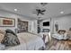 Comfortable main bedroom showcasing a built-in bookcase, TV, and fireplace at 5805 Cabo San Lucas Ave, Las Vegas, NV 89131