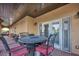 Covered patio with outdoor seating, ceiling, and decorative table at 5805 Cabo San Lucas Ave, Las Vegas, NV 89131