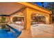 Inviting pool with a covered patio, outdoor kitchen, and bar seating for a perfect outdoor entertaining space at 5805 Cabo San Lucas Ave, Las Vegas, NV 89131
