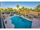 Inviting backyard pool and spa surrounded by lush landscaping and palm trees at 5805 Cabo San Lucas Ave, Las Vegas, NV 89131