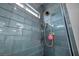 Shower with blue tile walls and shower head at 5805 Cabo San Lucas Ave, Las Vegas, NV 89131