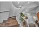 Elegant curving staircase with white railing and wood steps, creating a grand entrance at 5805 Cabo San Lucas Ave, Las Vegas, NV 89131