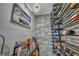 Stylish wine cellar featuring metal wine racks, gray stone and unique decorative lighting at 5805 Cabo San Lucas Ave, Las Vegas, NV 89131
