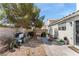 Spacious backyard with a mix of gravel and concrete and ample gardening space at 5914 Rose Sage St, North Las Vegas, NV 89031
