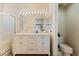 Bathroom features double sinks, great lighting, and a glass enclosed shower at 5914 Rose Sage St, North Las Vegas, NV 89031