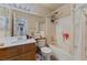 Bathroom featuring a combination tub/shower and a single sink vanity at 5914 Rose Sage St, North Las Vegas, NV 89031