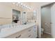 Bright bathroom featuring double sinks with marble countertop and a separate toilet room at 5914 Rose Sage St, North Las Vegas, NV 89031