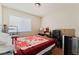 Bedroom with natural light, wood floors and simple furnishings at 5914 Rose Sage St, North Las Vegas, NV 89031