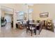 Bright dining area with an open concept, tile flooring, and a view of the living room at 5914 Rose Sage St, North Las Vegas, NV 89031
